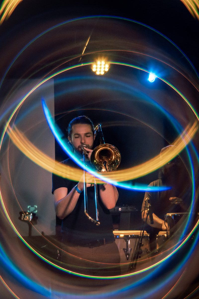 Jared Ramos performing, long exposure light trails
